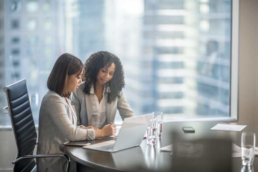 Two IT professionals working on M&A roadmap