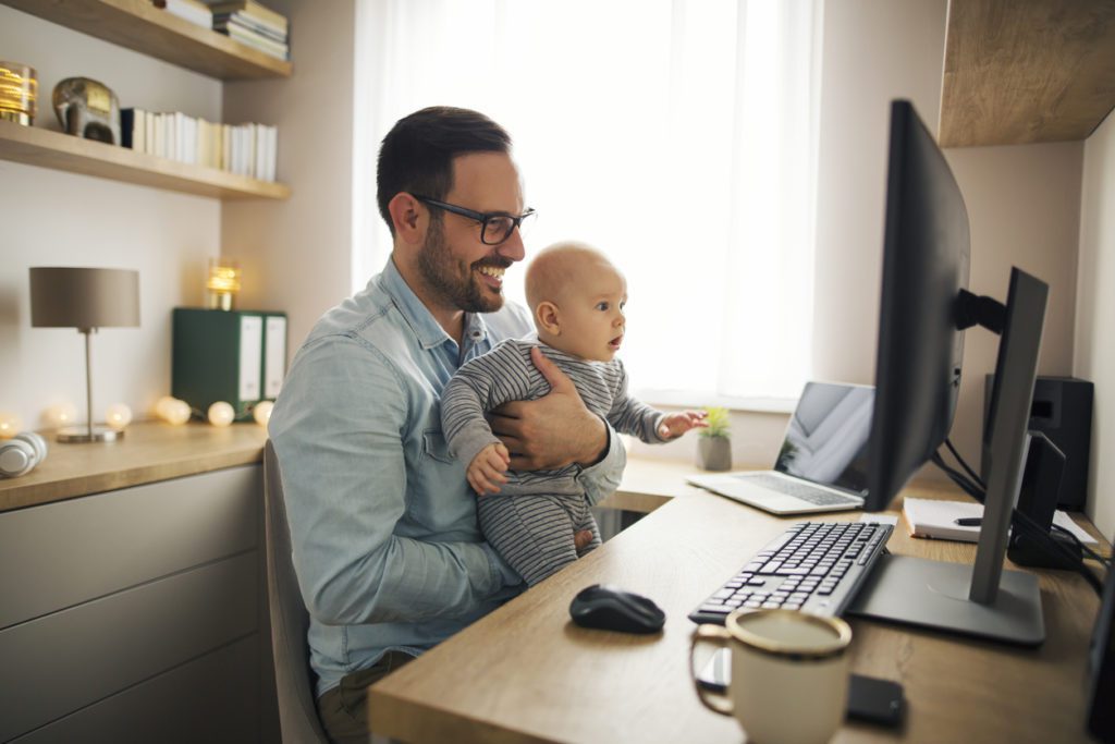 remote work while playing with his baby boy